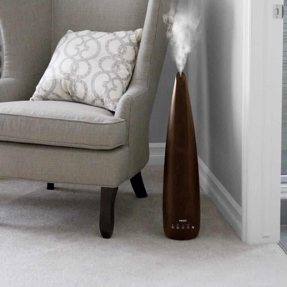 Homedics TotalComfort 2-in-1 Warm and Cool Humidifier on floor next to couch