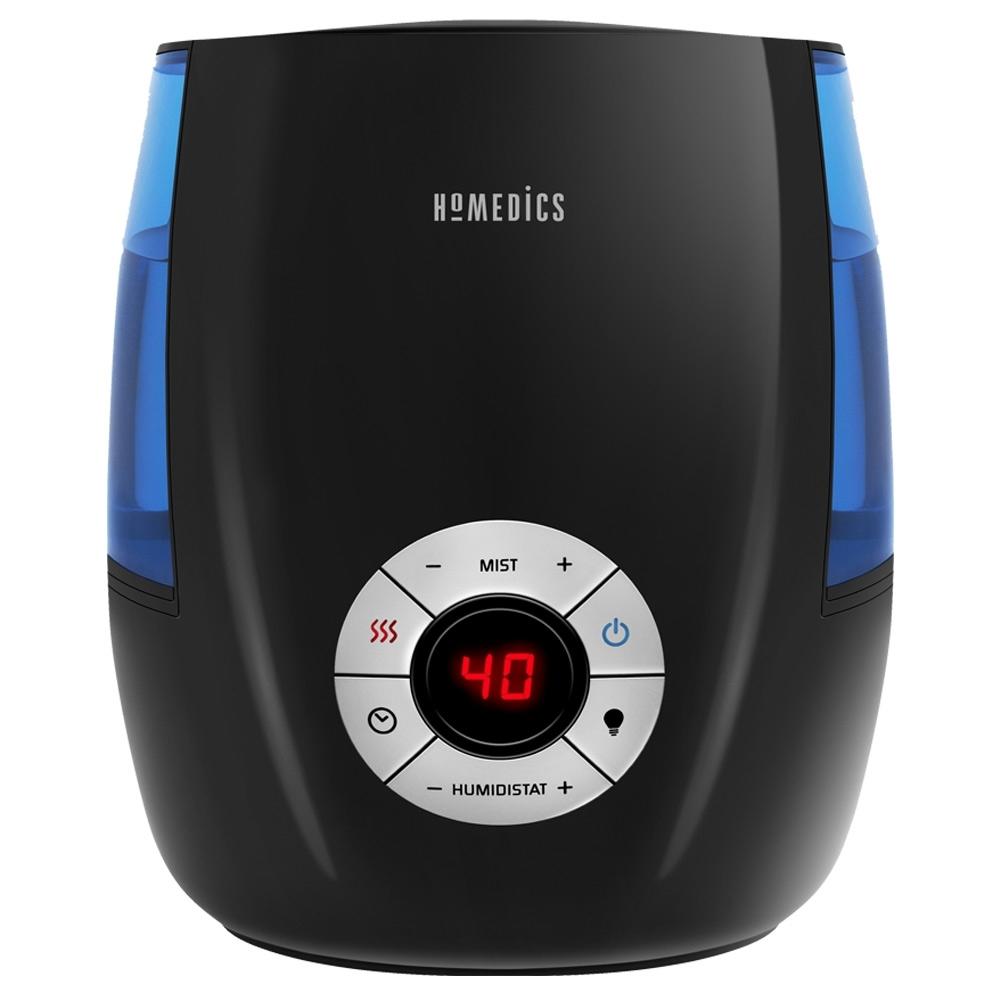 Homedics Warm and Cool Mist Ultrasonic Humidifier on night stand next to bed