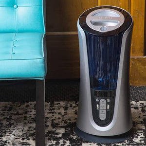 Homedics TotalComfort Humidifier Deluxe on floor next to chair