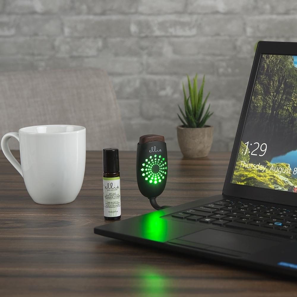 Homedics On the Go Travel Kit on desk next to laptop